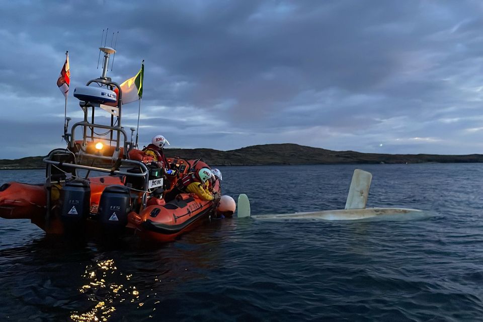 Clifden RNLI volunteers have rescued a sailor from the upturned hull of his sailing boat. Photo: RNLI/Mella Walsh