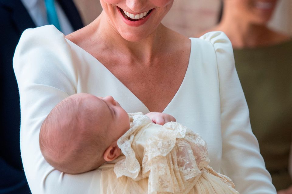 Kate carries Britain's Prince Louis as they arrive for his christening service at the Chapel Royal, St James's Palace, London. Photo: Dominic Lipinski/PA Wire