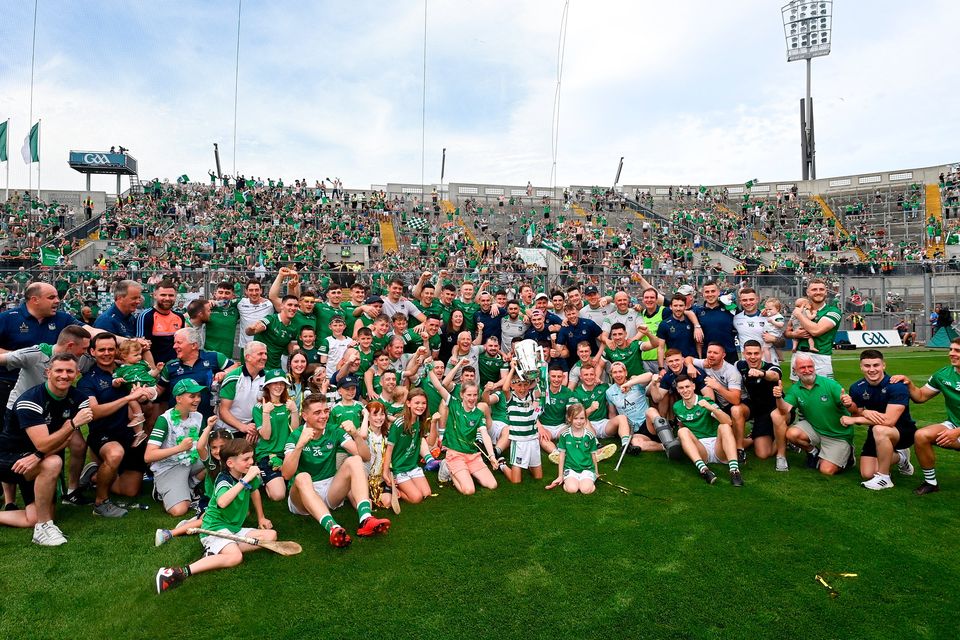 The Limerick team celebrate with backroom staff and family after their All-Ireland Senior Hurling Championship final win over Kilkenny