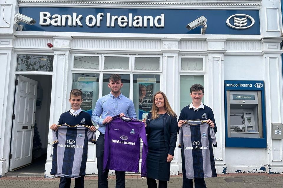 (l-r) Isaac Cacone, Teacher Cormac Byrne, Gillian Dunne, Bank of Ireland Customer Service Manager and Matthew Ryan,football team captain.