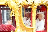 thumbnail: Britain's King Charles and Queen Camilla travel from Westminster Abbey in the Gold State Coach, following their coronation ceremony, in London, Britain May 6, 2023. REUTERS/Lisi Niesner