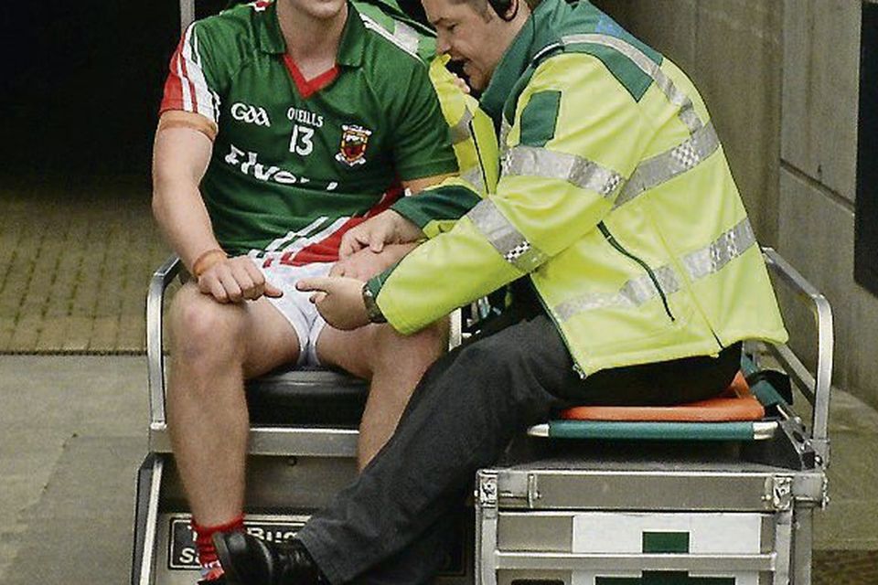 Cillian O’Connor leaves the field after a shoulder injury
