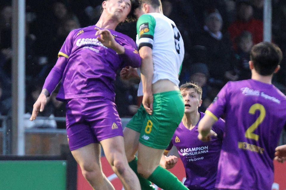 Goalscorer Brandon McCann battling with Kerry FC captain Matt Keane.