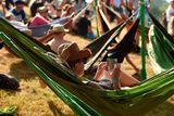 thumbnail: Revellers sit in hammocks as they attend the Glastonbury Festival of Music and Performing Arts on Worthy Farm near the village of Pilton in Somerset, South West England, on June 26, 2019. (Photo by Oli SCARFF / AFP)OLI SCARFF/AFP/Getty Images