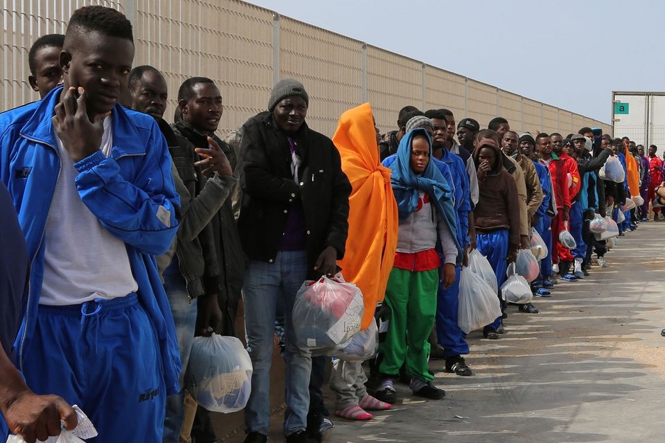 Migrants wait to leave the island of Lampedusa, southern Italy. (AP)