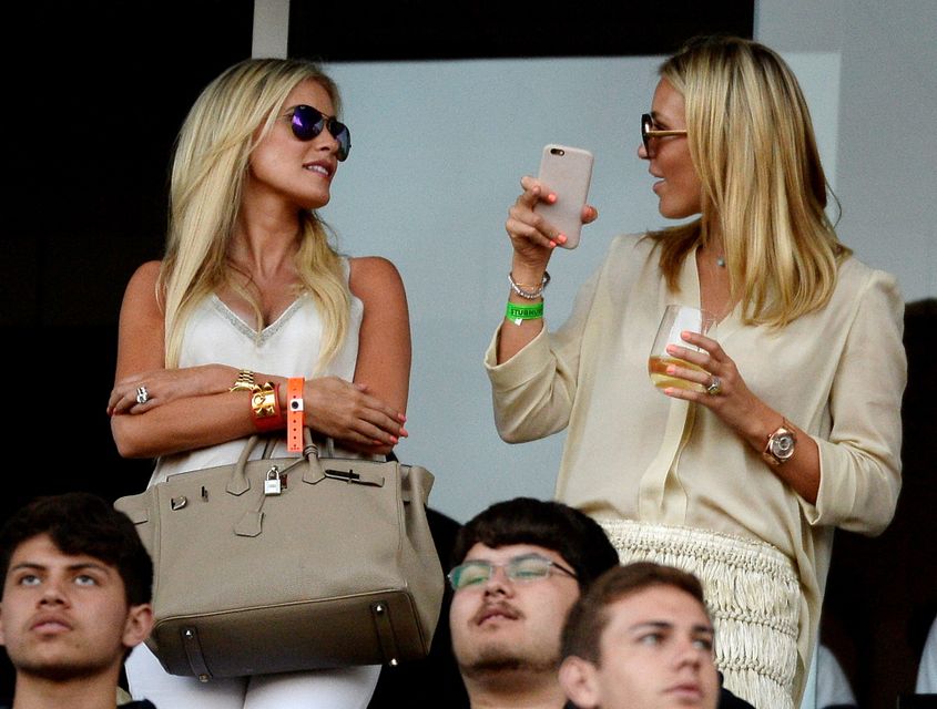 Alex Curran (L) wife of new Los Angeles Galaxy midfielder Steven Gerrard and Claudine Keane wife of Los Angeles Galaxy forward Robbie Keane stand in the owner's box before Gerrard is introduced in front of fans during halftime against Toronto FC on July 4, 2015 at StubHub Center in Carson, California. The former Liverpool captain Steven Gerrard is scheduled to play his first MLS match on Friday, July 17 at StubHub Center against San Jose Earthquakes. (Photo by Kevork Djansezian/Getty Images)