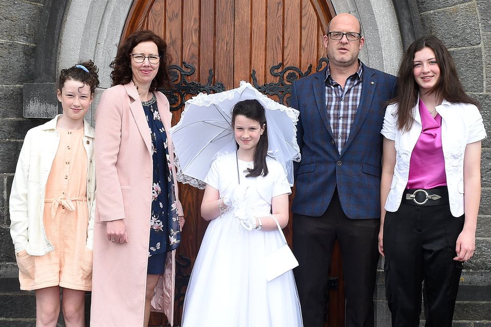 Kate O’Reilly who received their first holy communion in the Church of Mary Immaculate Collon with parents Tom and Claire, and sisters Helen and Emily. Photo: Colin Bell Photography