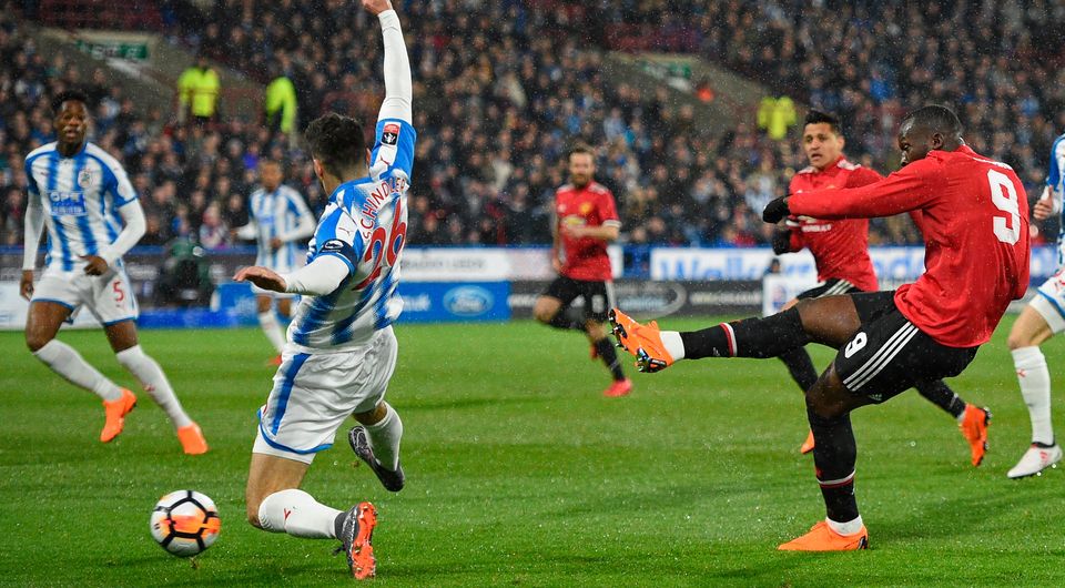 Manchester United's Belgian striker Romelu Lukaku shoots to score the opening goal. Photo: Getty Images