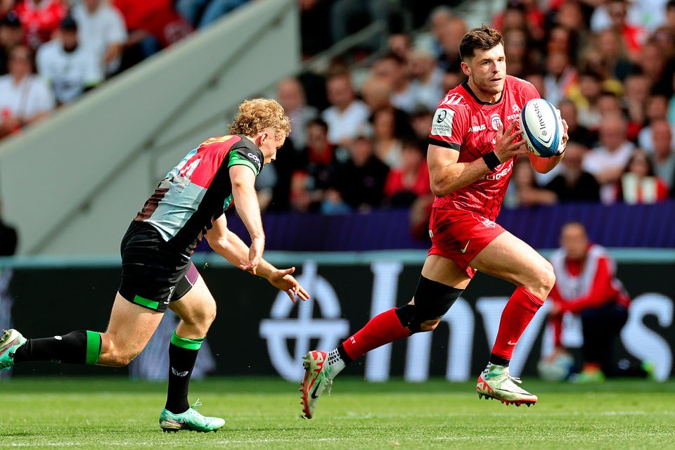 Blair Kinghorn of Toulouse gets away from Harlequins' Louis Lynagh during the Champions Cup semi-final at Le Stadium in Toulouse, France. Photo: David Rogers/Getty Images