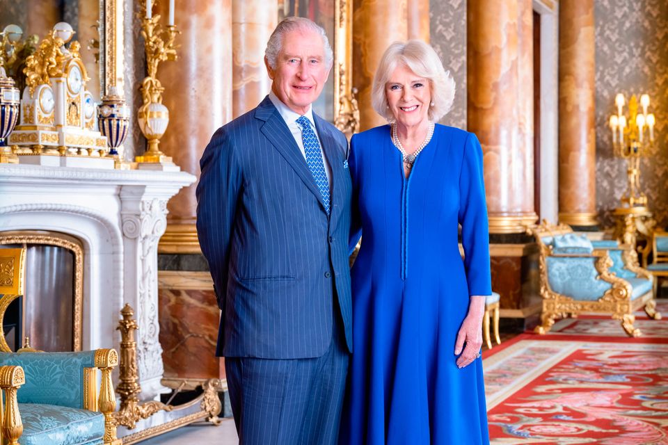 Handout photo issued by Buckingham Palace of King Charles III and the Queen Consort taken by Hugo Burnand in the Blue Drawing Room at Buckingham Palace, London