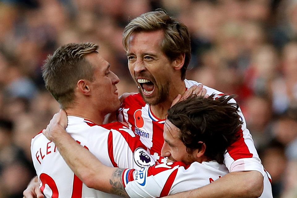 Peter Crouch, centre, celebrates scoring the equaliser