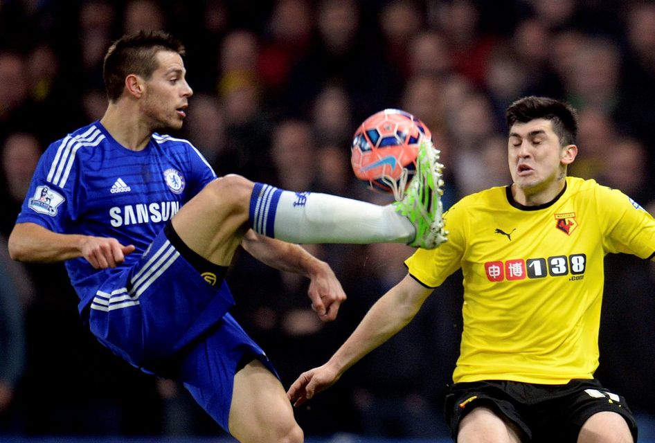 Chelsea's Cesar Azpilicueta (L) fights for the ball with Watford's Fernando Forestieri during their FA Cup third round soccer match at Stamford Bridge in London, January 4, 2015. REUTERS/Philip Brown (BRITAIN - Tags: SPORT SOCCER)