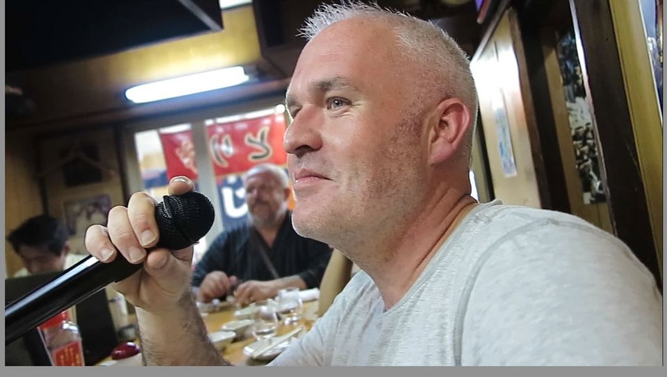 Mark Evans tries karaoke in Osaka