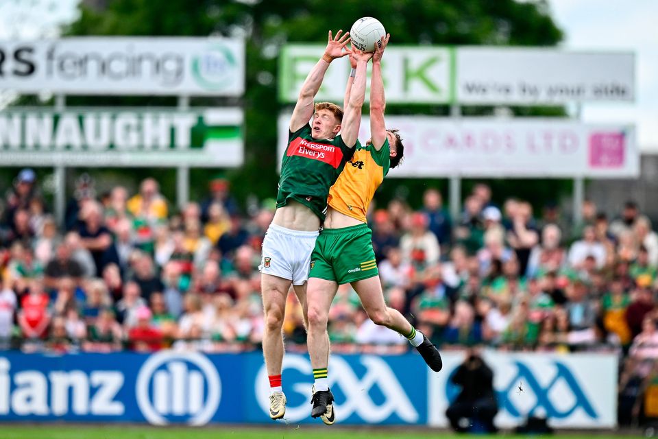 David McBrien of Mayo in action against Ciaran Thompson of Donegal during the All-Ireland SFC round 3 match at King & Moffatt Dr Hyde Park in Roscommon. Photo: Seb Daly/Sportsfile