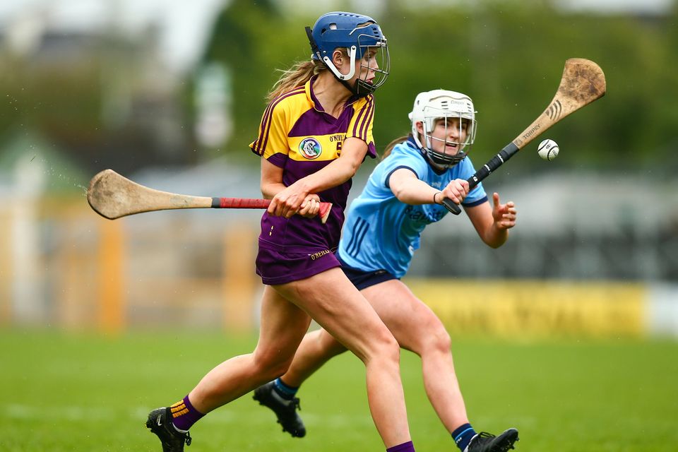 Róisín McGonigle clears from Eimear Kehoe. Photo: Ken Sutton/INPHO