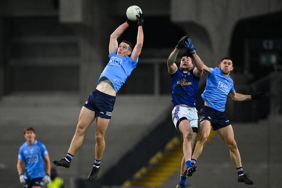 Brian Fenton of Dublin gathers possession ahead of team-mate David Byrne and Thomas Galligan of Cavan during the All-Ireland semi-final in 2020. Photo: Sportsfile