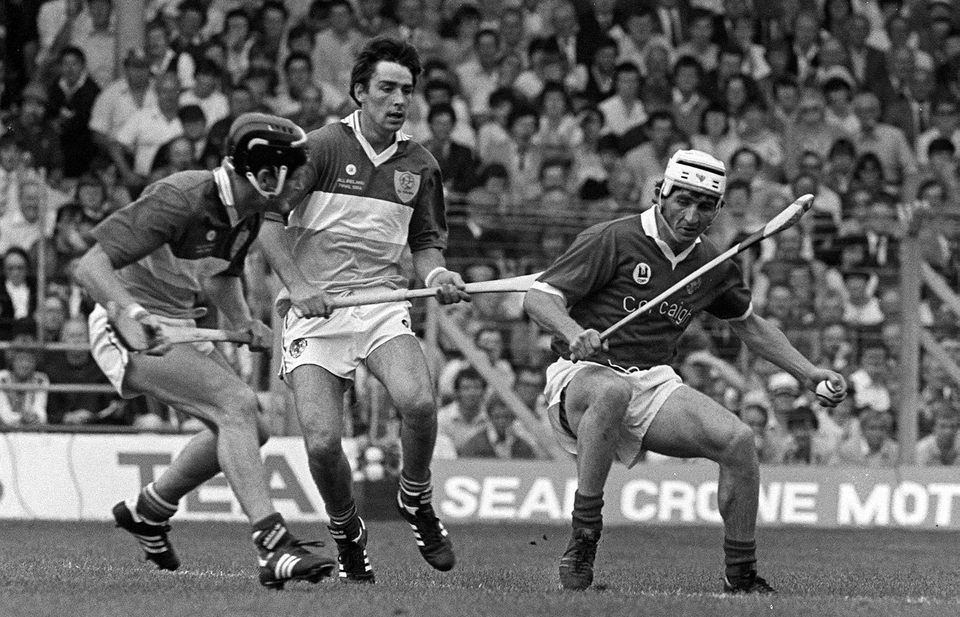 Cork's John Fenton in action against Offaly's Joachim Kelly and Tom Conneely in the 1984 All-Ireland Hurling Final