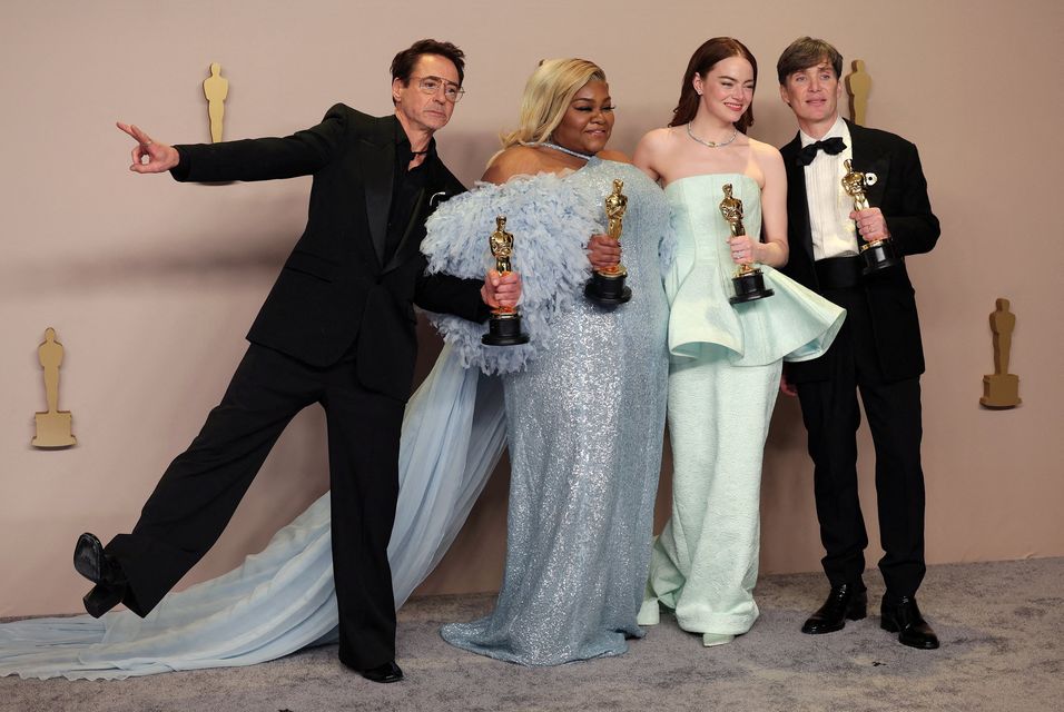 Cillian Murphy, winner of the Best Actor Oscar for "Oppenheimer", joins Emma Stone, winner of the Best Actress Oscar for "Poor Things", Da'Vine Joy Randolph, Best Supporting Actress Oscar winner for "The Holdovers", and Robert Downey Jr., Best Supporting Actor Oscar winner for "Oppenheimer", in the Oscars photo room at the 96th Academy Awards in Hollywood, Los Angeles, California, U.S., March 10, 2024. REUTERS/Carlos Barria    