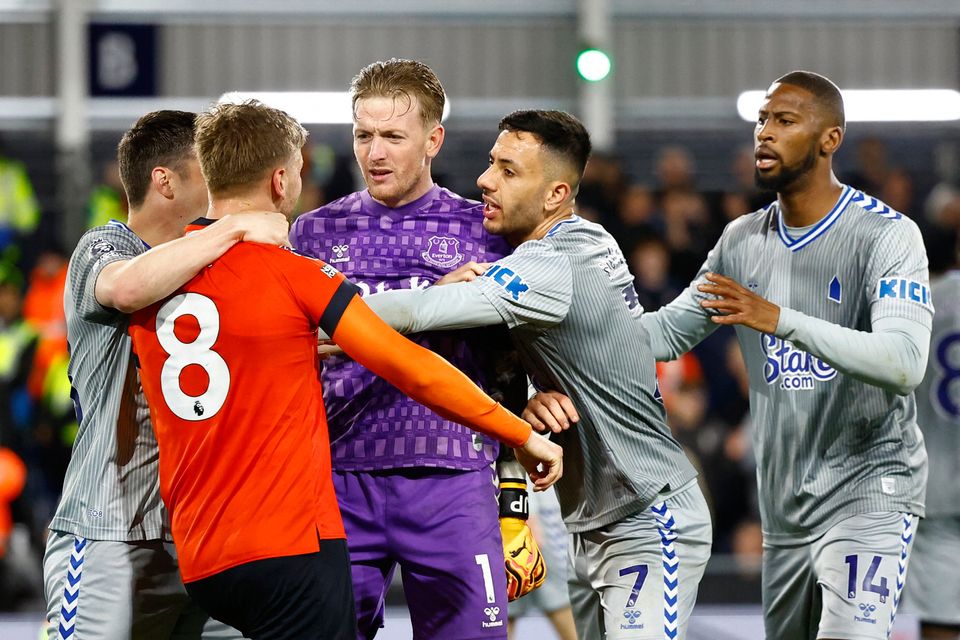 Everton's Jordan Pickford and Dwight McNeil clash with Luton Town's Luke Berry after the match
