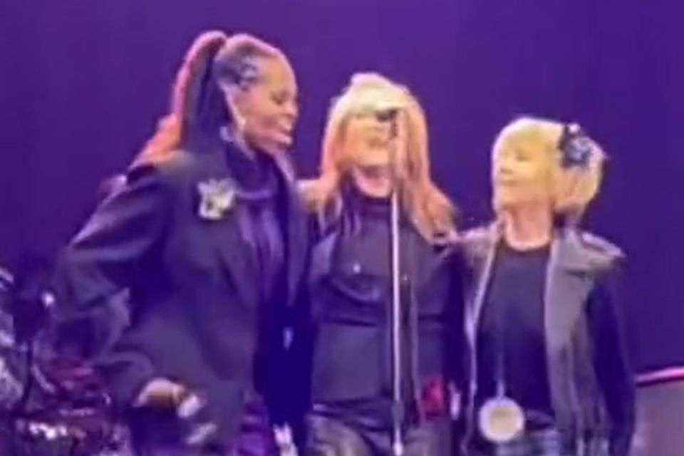 Michelle Obama sings with Patti Scialfa (centre) at the Bruce Springsteen concert in Barcelona