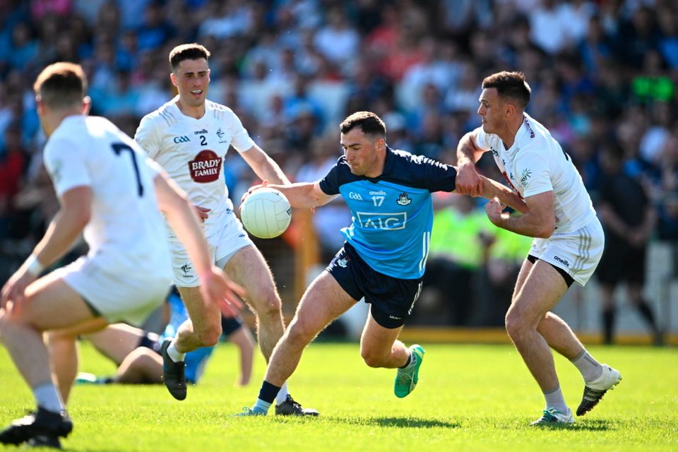 Colm Basquel of Dublin is tackled by Eoin Doyle of Kildare