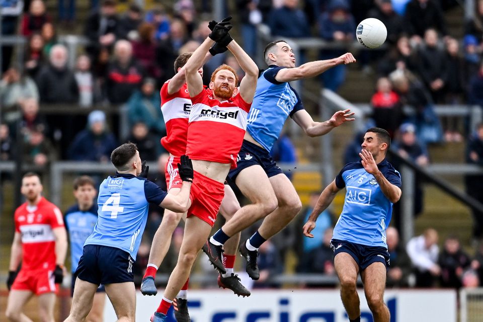 Dublin's Brian Fenton in action against Conor Glass of Derry during their Allianz NFL Division 2 match at Celtic Park last year. Photo: Ramsey Cardy/Sportsfile