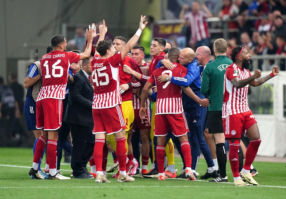 Olympiacos celebrate their victory (Zac Goodwin/PA)