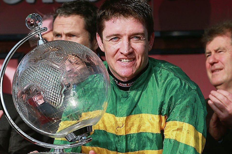 Barry Geraghty with the World Hurdle trophy at Cheltenham. Photo: PA