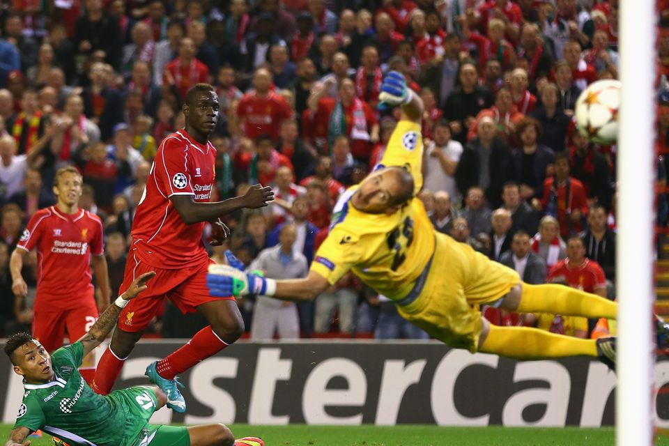 Mario Balotelli of Liverpool scores the opening goal past Milan Borjan of PFC Ludogorets Razgrad  during the UEFA Champions League Group B match between Liverpool FC and PFC Ludogorets Razgrad at Anfield