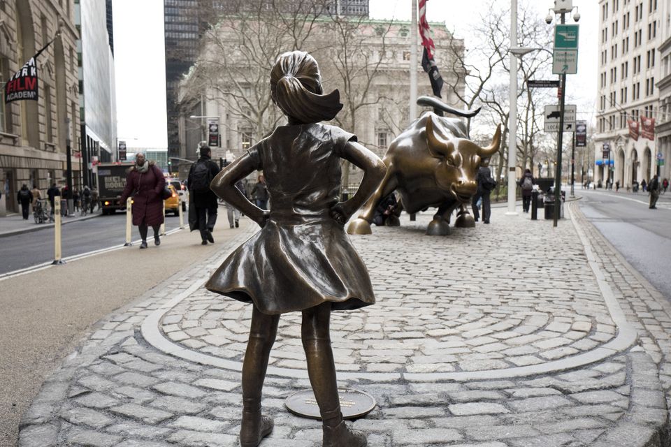 The Fearless Girl statue faces Wall Street's charging bull in New York (AP/Mark Lennihan)