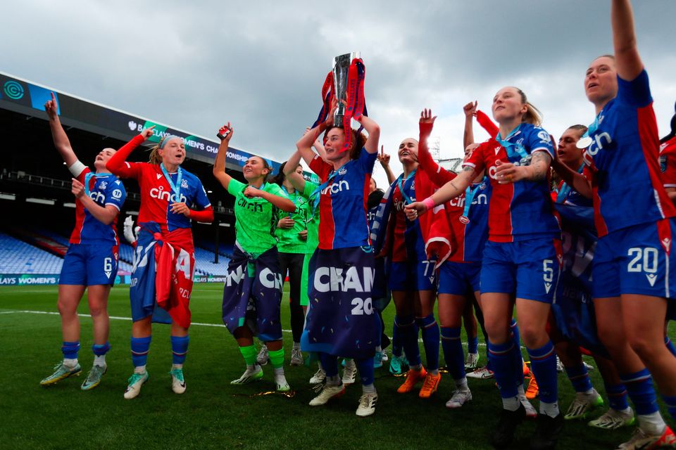 Crystal Place players celebrate with the Women’s Championship trophy at Selhurst Park, London. Photo: Rhianna Chadwick/PA Wire