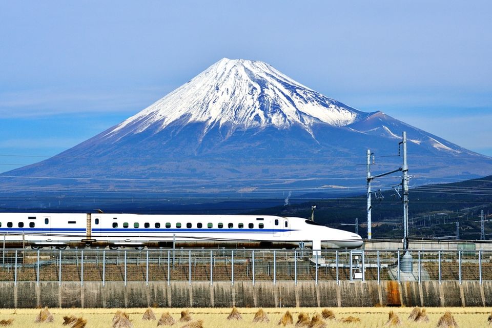 A bullet train passes below Mt. Fuji in Japan