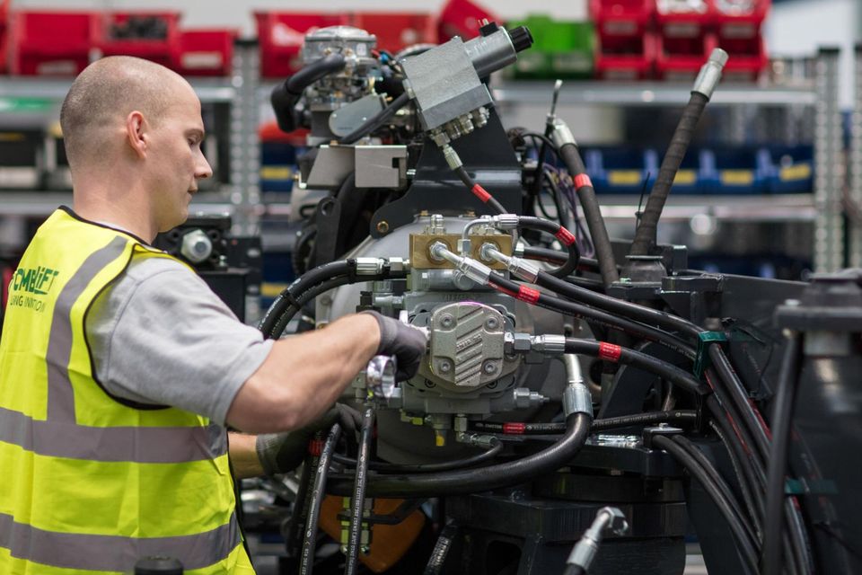 A worker assembles part of a forklift truck at the Combilift factory in Co Monaghan which exports to Australia. Photograph: Patrick Bolger/Bloomberg