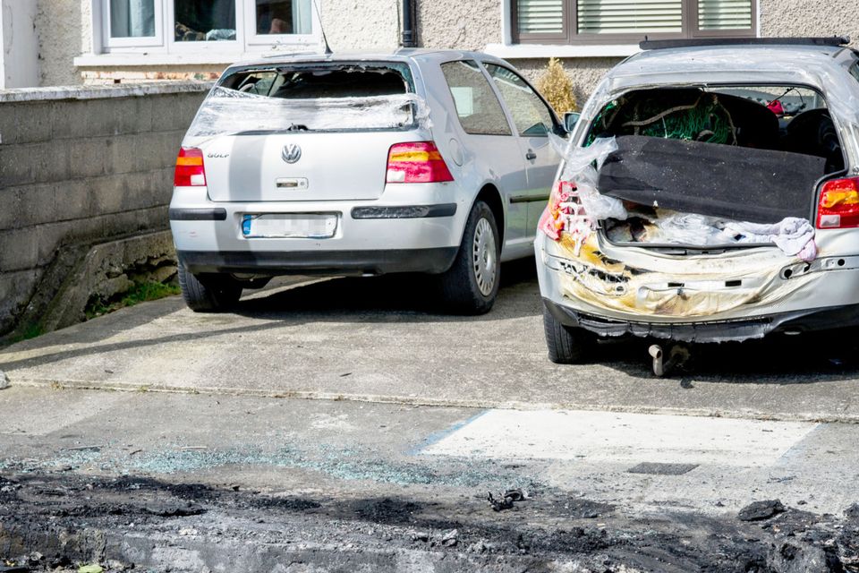 The back of the car melted after the bomb went off in the Lough Conn Avenue estate. Photo: Douglas O'Connor/www.doug.ie