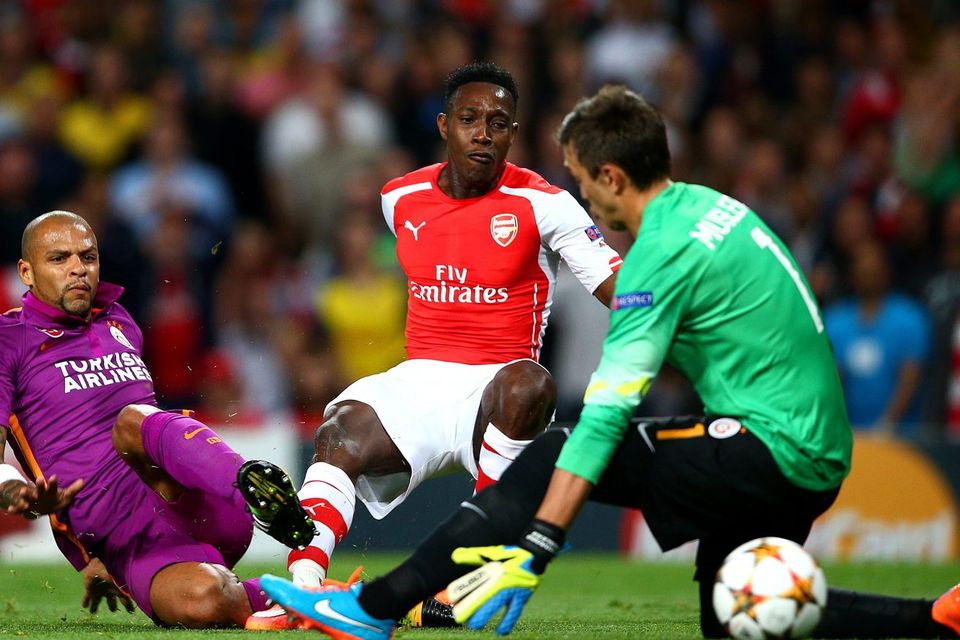 Danny Welbeck slips the ball past Galatasaray goalkeeper Fernando Muslera to open the scoring for Arsenal in the Champions League clash at the Emirates. Photo: Paul Gilham/Getty Images