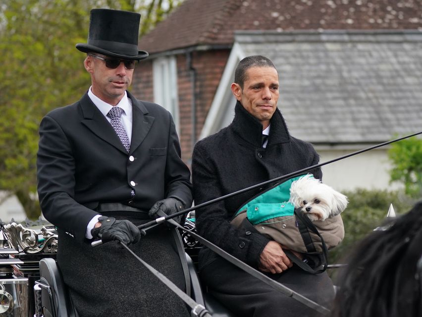 Husband of Paul O’Grady Andre Portasio rides with the funeral cortege (Yui Mok/PA)