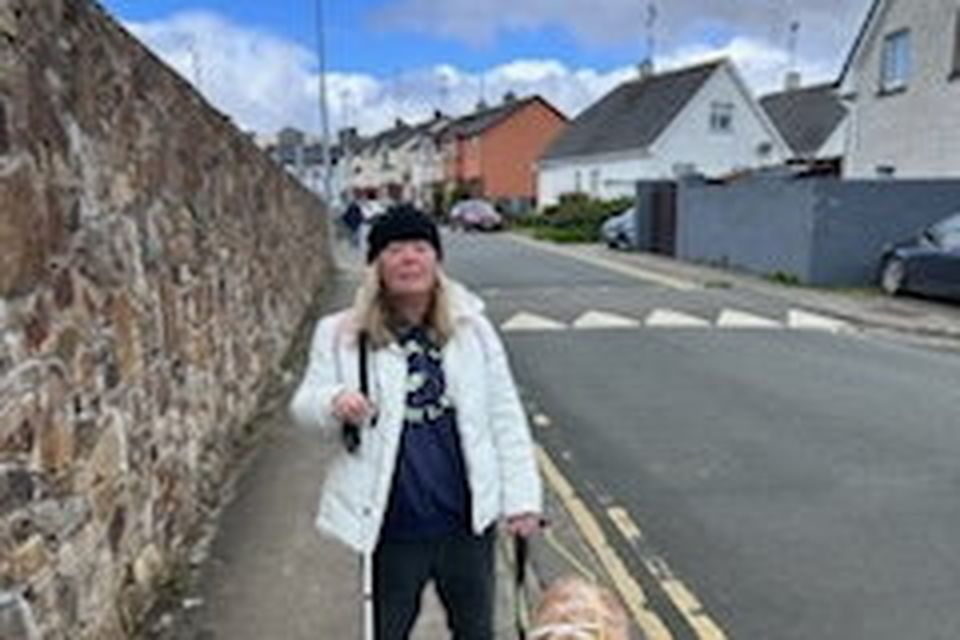 Yvonne Weaver with her guide dog.