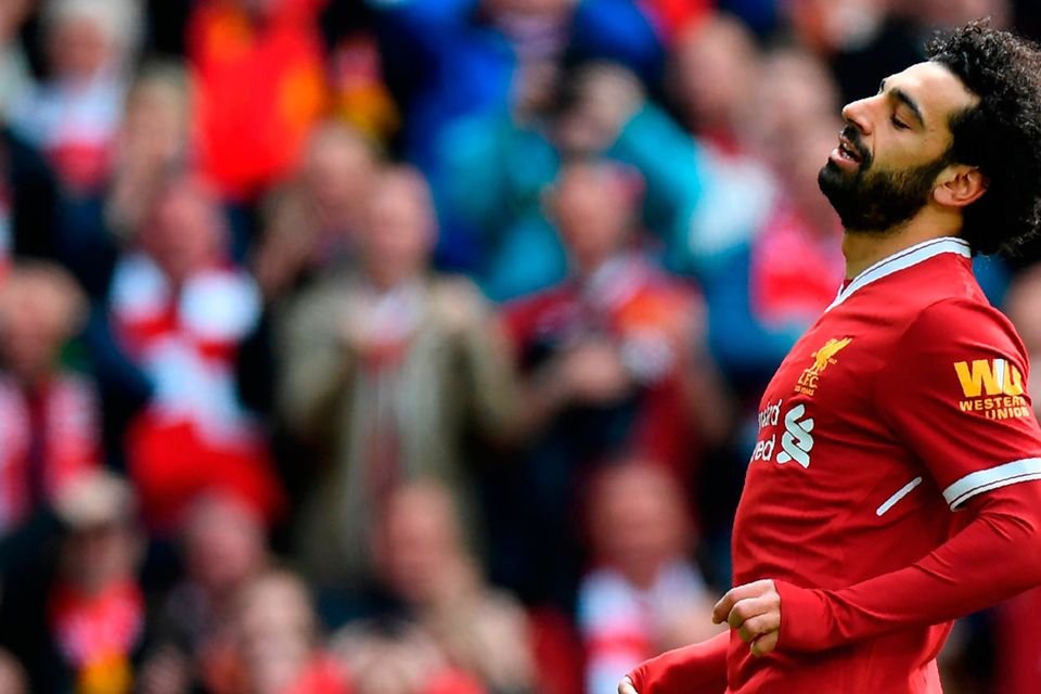 Liverpool's Egyptian midfielder Mohamed Salah reacts to missing a shot at goal during the English Premier League football match between Liverpool and Stoke City at Anfield in Liverpool, north west England on April 28, 2018. / AFP PHOTO / Paul ELLIS