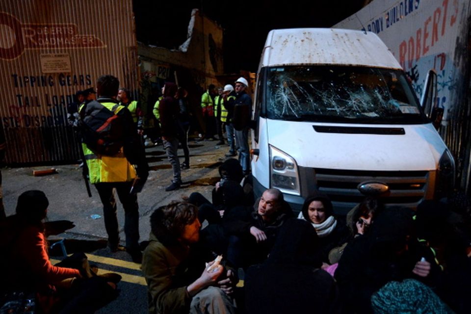 Protestors sitting down in front of van (with smashed windscreen) that tried to exit from site at Grangegorman lower, Dublin
