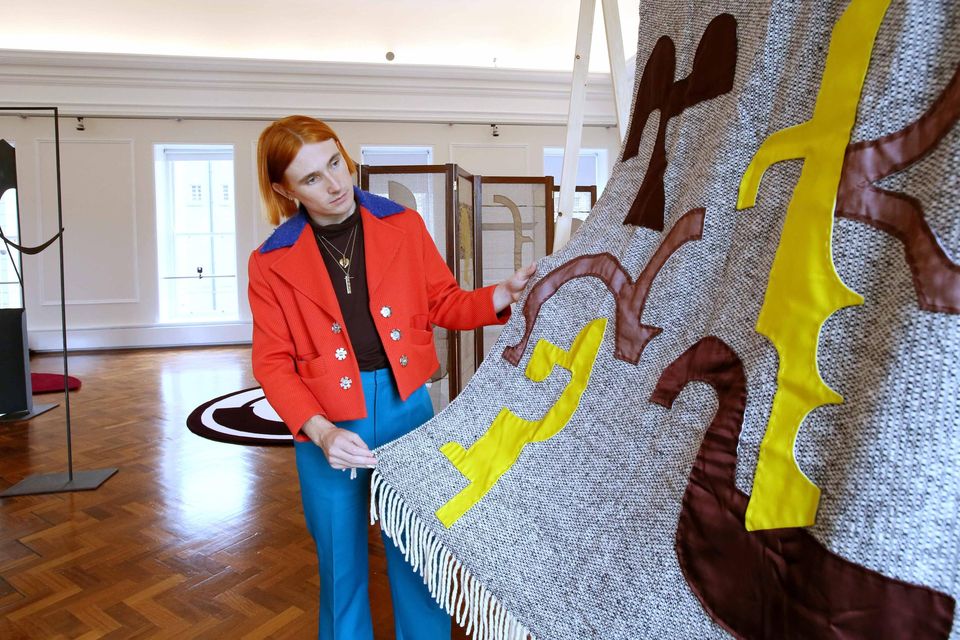 Richard Malone with a piece he created in collaboration with Mourne Textiles. Photo: Mark Stedman