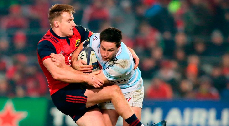 Racing 92's French centre Henry Chavancy (R) is tackled by Munster's Irish hooker Niall Scannell. Photo: Getty Images