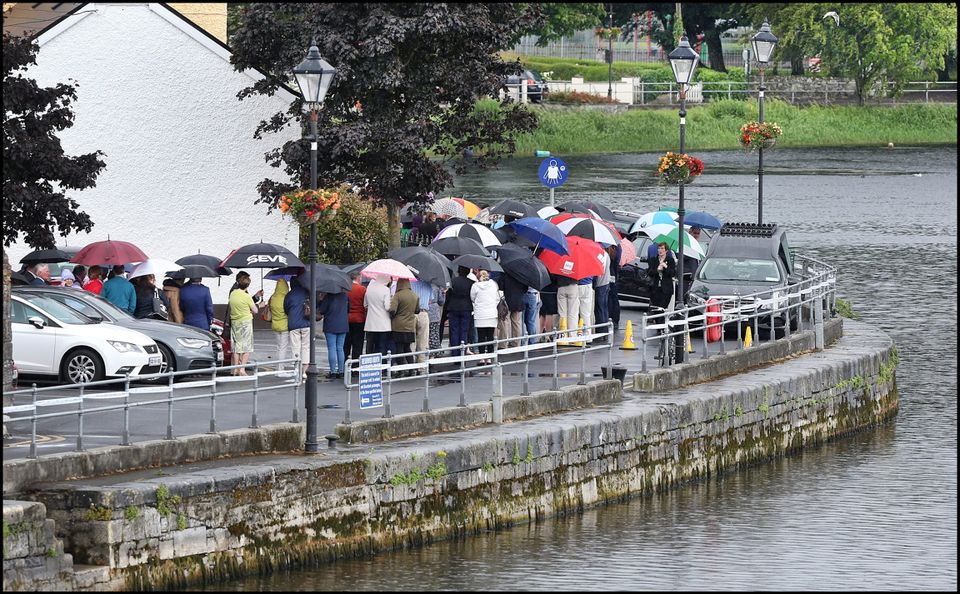 Crowds gather at Flynn's Funeral Home on The Strand along the banks of the Shannon for Larry and Martina Hayes tragically killed in Tunisia who were reposing there.
Pic Steve Humphreys
2nd July 2015.