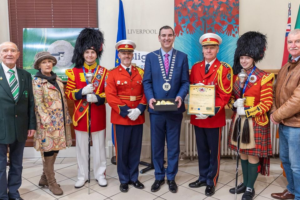 Mayor of the Borough District of Sligo Cllr Tom MacSharry makes a presentation at City Hall to Rob Bennett (Managing Director) and Francis Smith (Music Director) of the Burlington Teen Tour Band. Also included are Parade Marshall, Tom McSharry , Gail McGibbon of Sligo BID and Cllr Declan Bree.