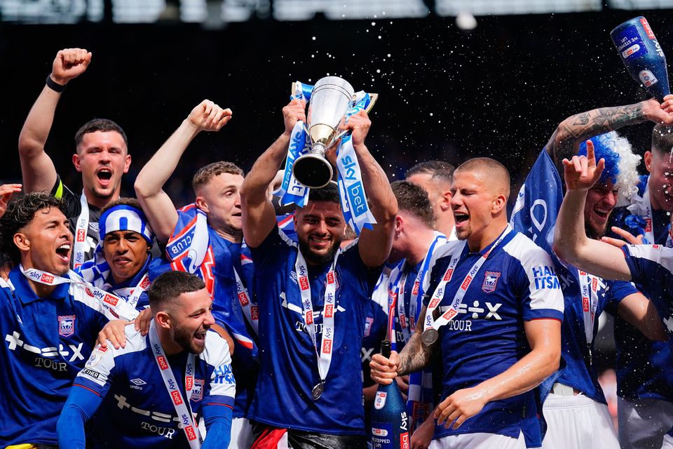 Ipswich Town's Sam Morsy celebrates with the trophy at Portman Road, Ipswich. Photo: PA