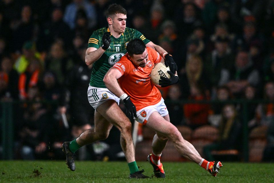Armagh's Aidan Forker is tackled by Meath's Eoghan Frayne during their Allianz FL Division duel at BOX-IT Athletic Grounds last February. Photo: Ben McShane/Sportsfile