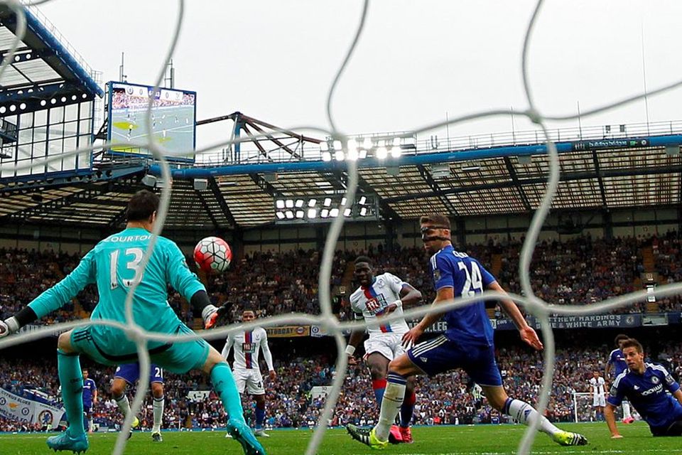 Bakary Sako scores the opening goal for Crystal Palace in their victory over Chelsea at Stamford Bridge yesterday