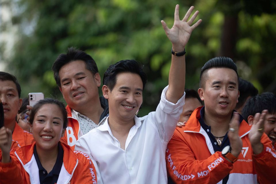 Pita Limjaroenrat (white shirt), leader of the Move Forward Party, waves to his supporters in Bangkok. Photo: AP