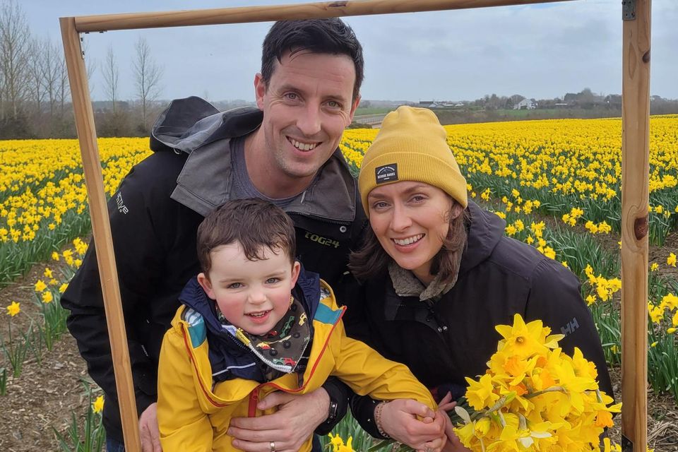 Jack and Orla Mac Giolla Bhríde with their son Rían at the charity open day at Elmgrove Flower Farm