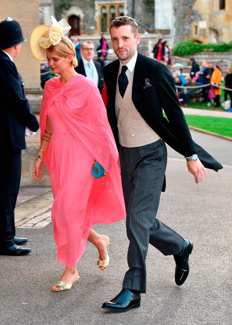 Pixie Geldof and George Barnett arrive at the grounds of Windsor Castle during the wedding of Princess Eugenie to Jack Brooksbank at St George's Chapel in Windsor Castle