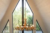 thumbnail: The floor-to-ceiling glass façade in one of the lodges